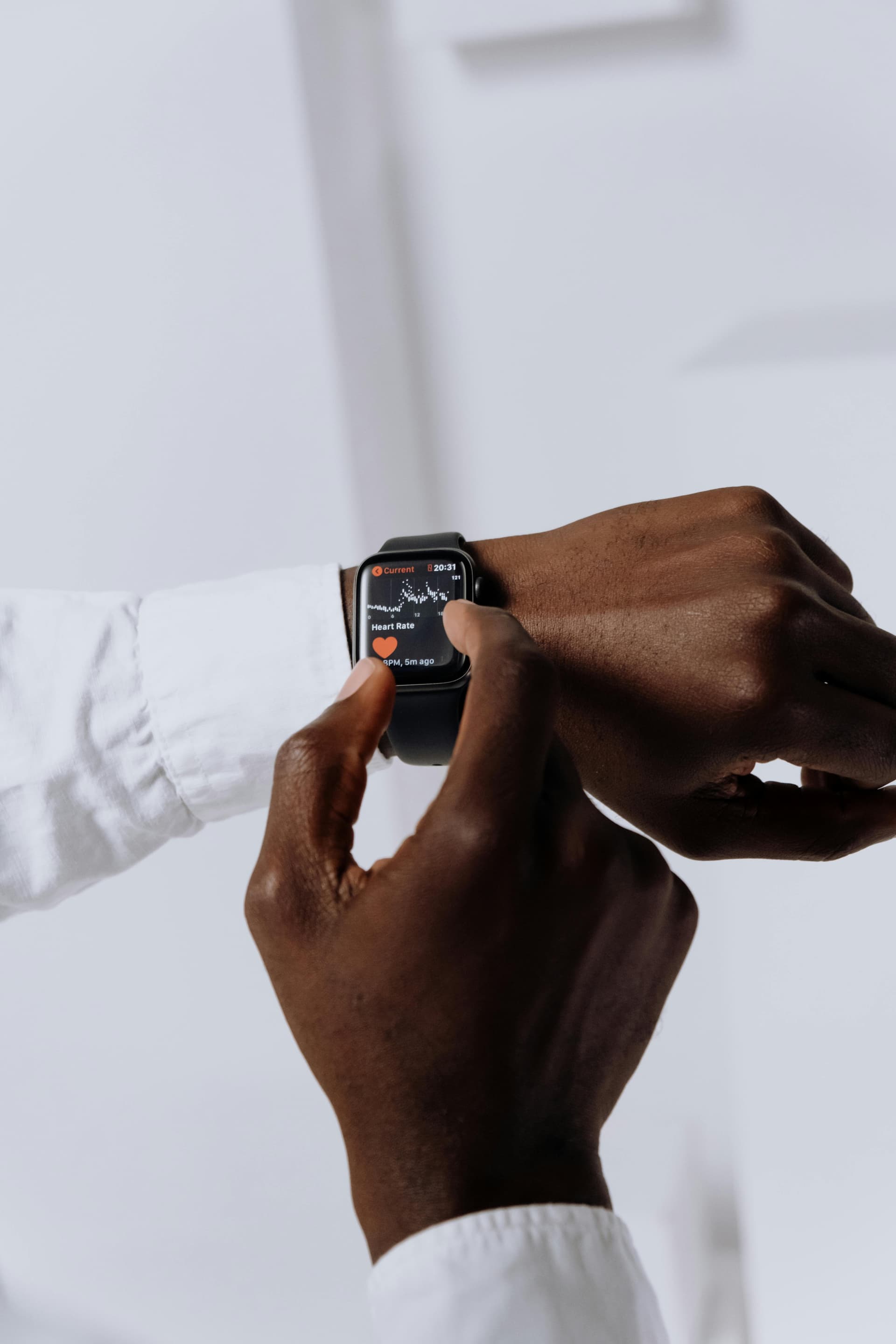 Man checking heart rate on Apple Watch