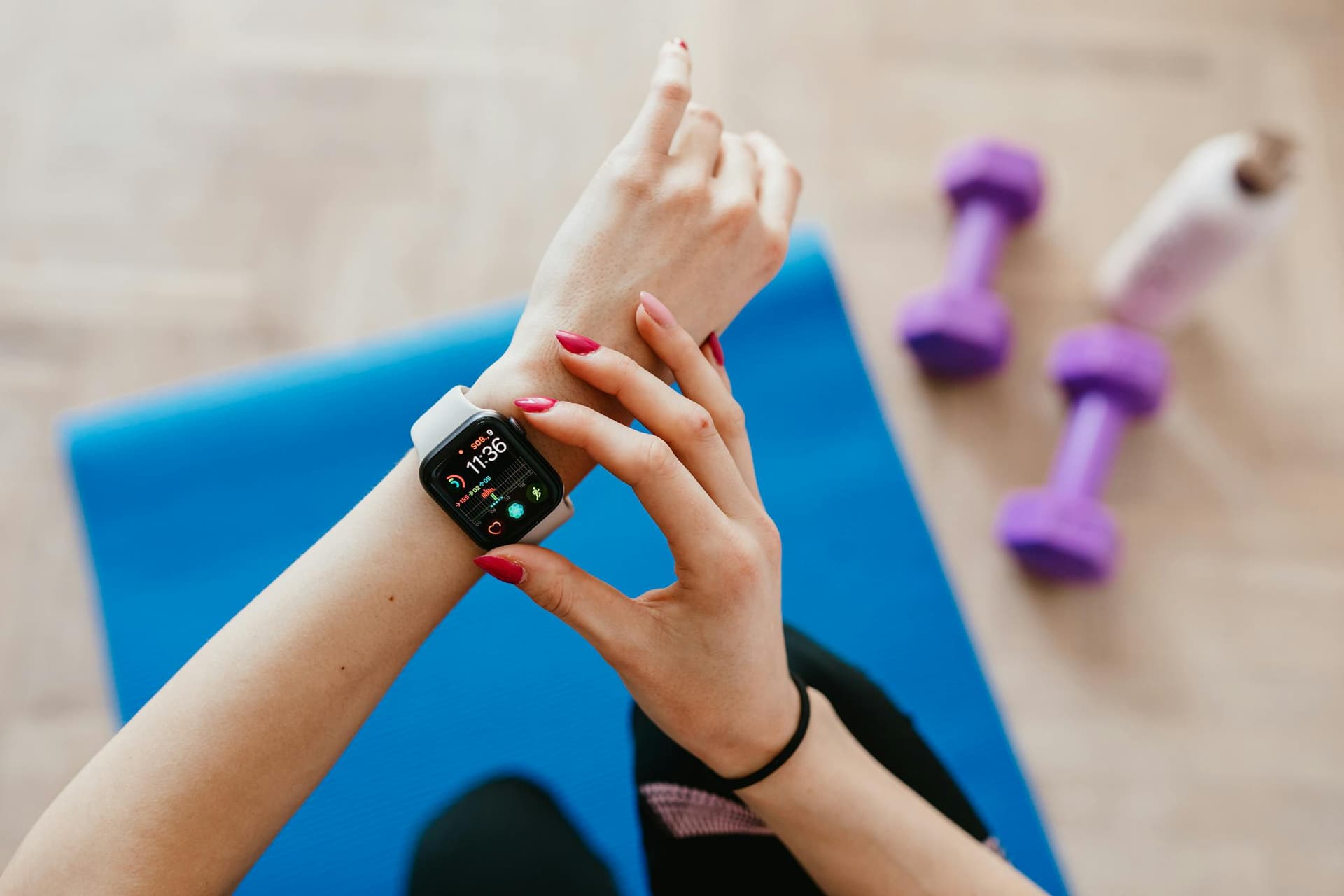 Runner finishing a workout and reviewing stats on Apple Watch